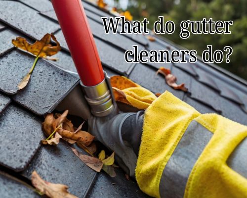 Gutter cleaner removing leaves from rooftop gutter